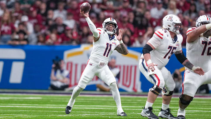 Dec 28, 2023; San Antonio, TX, USA;  Arizona Wildcats quarterback Noah Fifita (11) throws a pass against the Oklahoma Sooners in the first half at Alamodome. Mandatory Credit: Daniel Dunn-USA TODAY Sports