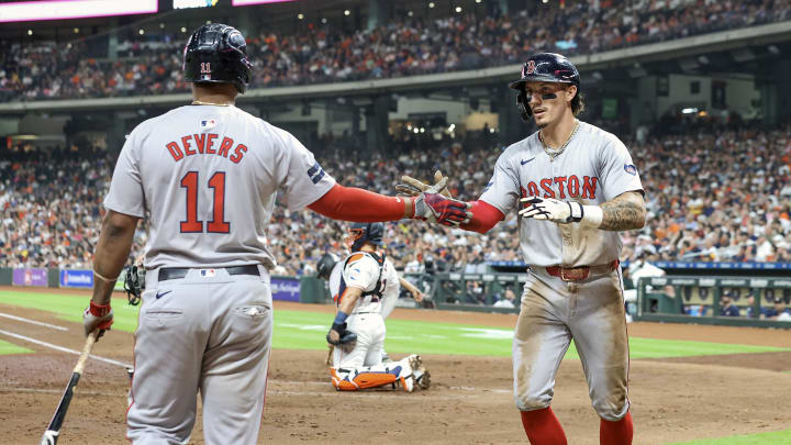 Aug 20, 2024; Houston, Texas, USA; Boston Red Sox center fielder Jarren Duran (16) celebrates with third baseman Rafael Devers (11) after scoring a run during the fourth inning against the Houston Astros at Minute Maid Park. Mandatory Credit: Troy Taormina-USA TODAY Sports