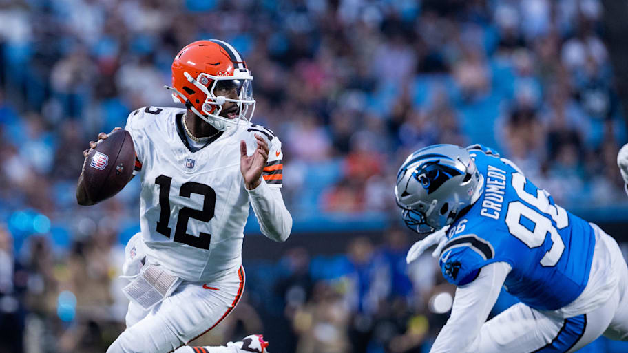 Browns quarterback Shedeur Sanders gets away Panthers defensive tackle Jaden Crumedy during the second quarter.