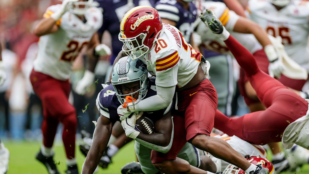 Aug 23, 2025; Dublin, IRELAND; Kansas State player Joe Jackson is tackled by Khijohnn Cummings-Coleman of Iowa State during the Aer Lingus Classic between Iowa State and Kansas State at Aviva Stadium. Mandatory Credit: Laszlo Geczo/INPHO via Imagn Images