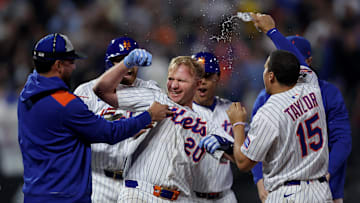 May 12, 2025; New York City, New York, USA; New York Mets first baseman Pete Alonso (20) celebrates with teammates after his ninth inning walkoff RBI sacrifice fly against the Pittsburgh Pirates at Citi Field. Mandatory Credit: Brad Penner-Imagn Images