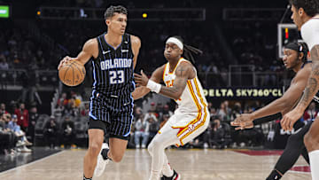 Apr 13, 2025; Atlanta, Georgia, USA; Orlando Magic forward Tristan da Silva (23) dribbles against Atlanta Hawks guard Terance Mann (14) during the first half at State Farm Arena. Mandatory Credit: Dale Zanine-Imagn Images
