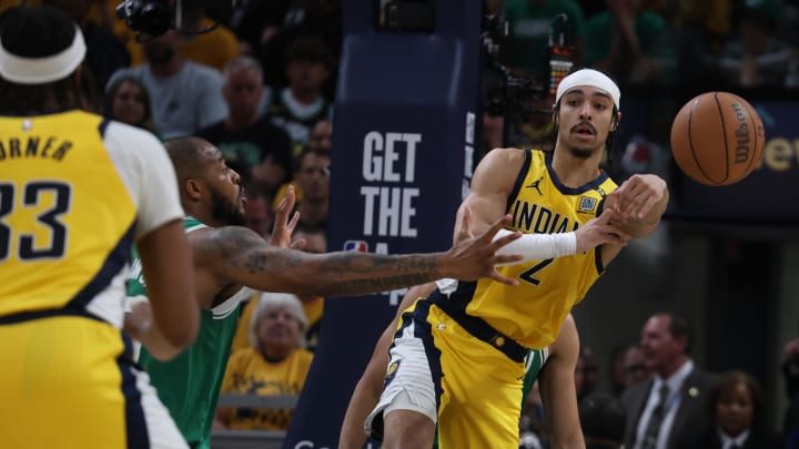 May 25, 2024; Indianapolis, Indiana, USA; Indiana Pacers guard Andrew Nembhard (2) passes the ball to center Myles Turner (33) against the Boston Celtics during the fourth quarter of game three of the eastern conference finals in the 2024 NBA playoffs at Gainbridge Fieldhouse. Mandatory Credit: Trevor Ruszkowski-USA TODAY Sports