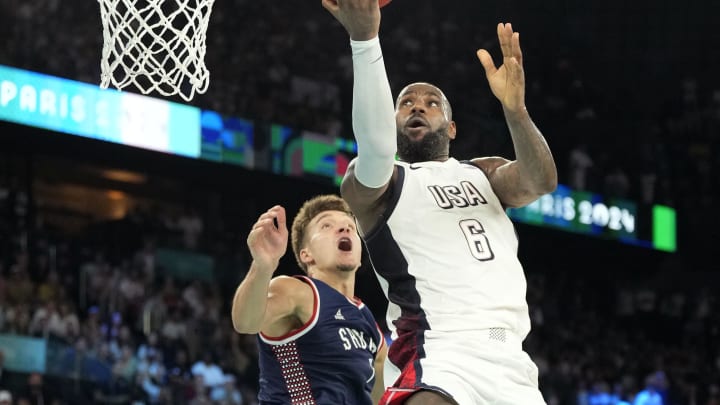 Aug 8, 2024; Paris, France; United States forward LeBron James (6) goes to the basket during the second half against Serbia in a men's basketball semifinal game during the Paris 2024 Olympic Summer Games at Accor Arena. Mandatory Credit: Kyle Terada-USA TODAY Sports