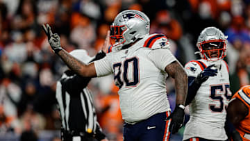 Dec 24, 2023; Denver, Colorado, USA; New England Patriots defensive tackle Christian Barmore (90) reacts after a play ]in the third quarter against the Denver Broncos at Empower Field at Mile High. Mandatory Credit: Isaiah J. Downing-Imagn Images