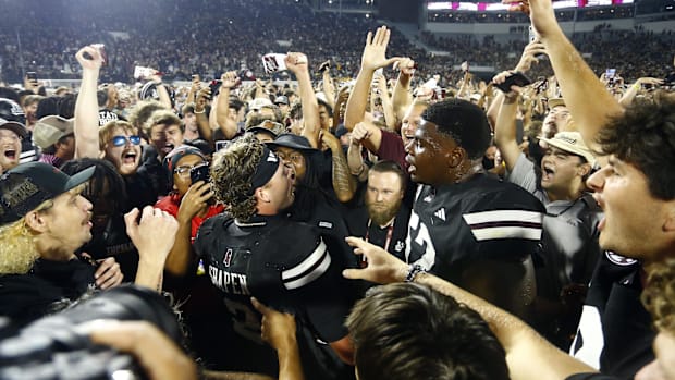 Mississippi State players and fans celebrate a win over Arizona State.