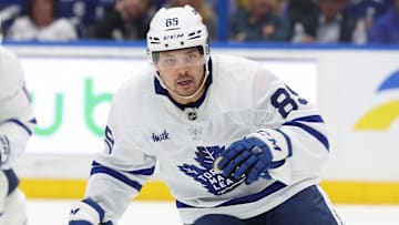 Apr 9, 2025; Tampa, Florida, USA; Toronto Maple Leafs left wing Nicholas Robertson (89) skates against the Tampa Bay Lightning during the first period at Amalie Arena. 