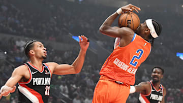 Nov 1, 2024; Portland, Oregon, USA; Oklahoma City Thunder guard Shai Gilgeous-Alexander (2) brings down an offensive rebound against Portland Trailblazers forward Toumani Camara (33) during the first quarter at Moda Center. Mandatory Credit: Brian Murphy-Imagn Images