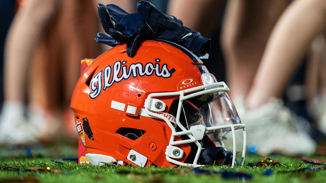 Dec 31, 2024; Orlando, FL, USA; A Illinois Fighting Illini helmet sitting on confetti after the game against the South Carolina Gamecocks at Camping World Stadium. Mandatory Credit: Jeremy Reper-Imagn Images