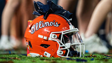 Dec 31, 2024; Orlando, FL, USA; A Illinois Fighting Illini helmet sitting on confetti after the game against the South Carolina Gamecocks at Camping World Stadium. Mandatory Credit: Jeremy Reper-Imagn Images