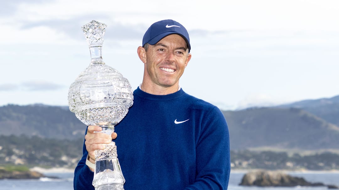 Rory McIlroy hoists the trophy following the final round of the 2025 AT&T Pebble Beach Pro-Am