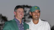 Apr 13, 2025; Augusta, Georgia, USA; Rory McIlroy holds the Masters championship trophy while posing for photographs with his caddie, Harry Diamond, at the green jacket ceremony during the final round of the Masters Tournament at Augusta National Golf Club. Mandatory Credit: Kyle Terada-Imagn Images