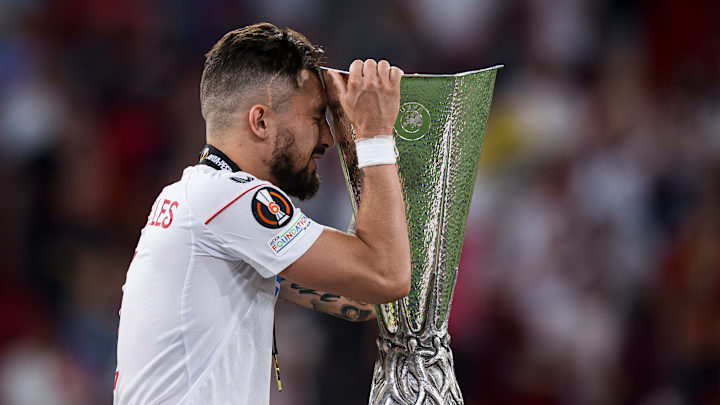 Alex Telles of Sevilla FC celebrates with the trophy during...