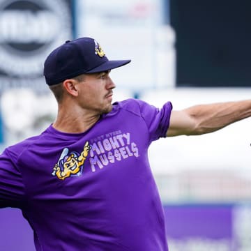 Pitcher Andrew Morris tosses the ball to warm up during a Fort Myers Mighty Mussels practice at Hammond Stadium in Fort Myers on Tuesday, April 4, 2023.

Fnp Jh 20230404 Musselsmediaday 0005