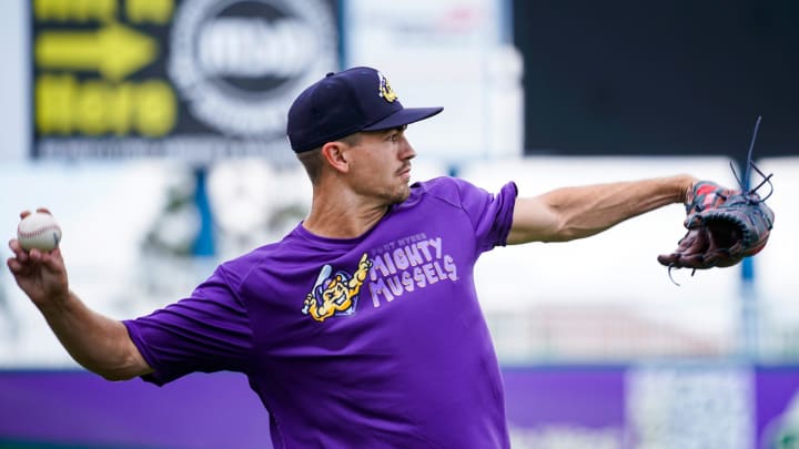 Pitcher Andrew Morris tosses the ball to warm up during a Fort Myers Mighty Mussels practice at Hammond Stadium in Fort Myers on Tuesday, April 4, 2023.

Fnp Jh 20230404 Musselsmediaday 0005