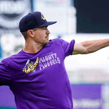 Pitcher Andrew Morris tosses the ball to warm up during a Fort Myers Mighty Mussels practice at Hammond Stadium in Fort Myers on Tuesday, April 4, 2023.

Fnp Jh 20230404 Musselsmediaday 0005