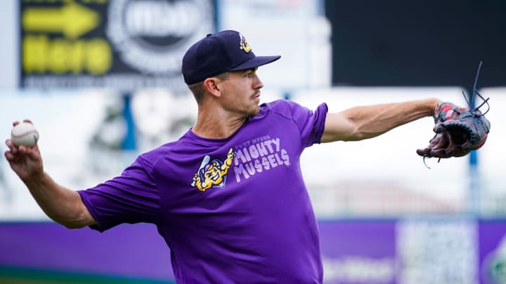 Pitcher Andrew Morris tosses the ball to warm up during a Fort Myers Mighty Mussels practice at Hammond Stadium in Fort Myers on Tuesday, April 4, 2023.

Fnp Jh 20230404 Musselsmediaday 0005