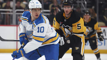Oct 27, 2025; Pittsburgh, Pennsylvania, USA; St. Louis Blues center Brayden Schenn (10) skates with the puck ahead of Pittsburgh Penguins defenseman Ryan Shea (5) during the third period at PPG Paints Arena. Mandatory Credit: Charles LeClaire-Imagn Images