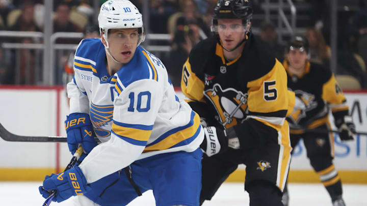 Oct 27, 2025; Pittsburgh, Pennsylvania, USA; St. Louis Blues center Brayden Schenn (10) skates with the puck ahead of Pittsburgh Penguins defenseman Ryan Shea (5) during the third period at PPG Paints Arena. Mandatory Credit: Charles LeClaire-Imagn Images