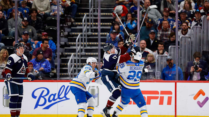 Apr 5, 2026; Denver, Colorado, USA; Colorado Avalanche center Parker Kelly (17) collides with St. Louis Blues right wing Jonatan Berggren (29) as left wing Jake Neighbours (63) looks on in the second period at Ball Arena. Mandatory Credit: Isaiah J. Downing-Imagn Images