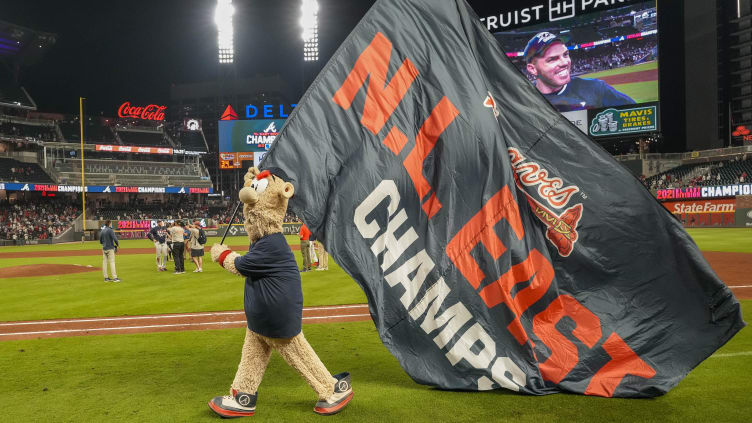 Sep 30, 2021; Cumberland, Georgia, USA; Atlanta Braves mascot Blooper carries the flag after the