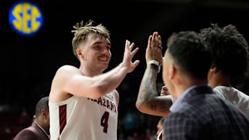 Feb 1, 2025; Tuscaloosa, AL, USA; Alabama forward Grant Nelson (4) is congratuled as he leaves the court in the closing moments of the game at Coleman Coliseum. Alabama downed Georgia 90-69. Mandatory Credit: Gary Cosby Jr.-Tuscaloosa News