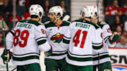 Apr 11, 2025; Calgary, Alberta, CAN; Minnesota Wild center Gustav Nyquist (41) celebrates his goal with teammates against the Calgary Flames during the third period at Scotiabank Saddledome. Mandatory Credit: Sergei Belski-Imagn Images