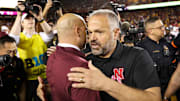 Oct 17, 2025; Minneapolis, Minnesota, USA; Nebraska Cornhuskers head coach Matt Rhule and Minnesota Golden Gophers head coach P.J. Fleck shake hands after the game at Huntington Bank Stadium. Mandatory Credit: Matt Krohn-Imagn Images