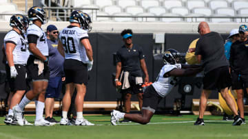Jacksonville Jaguars defensive end Michael Dogbe (98) hits a pad during the third and final day.