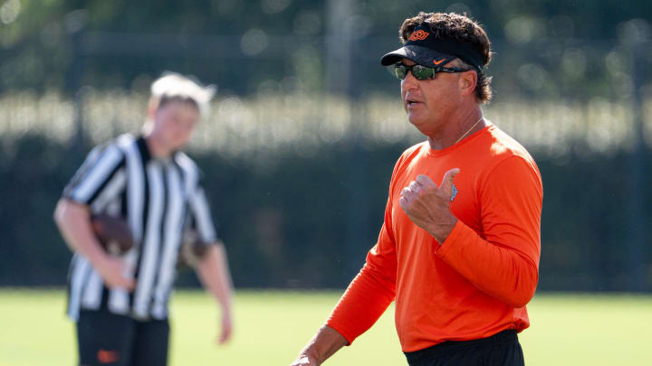 Head coach Mike Gundy walks on the field during an Oklahoma State football practice in Stillwater, Okla., on Saturday, Aug. 3, 2024.