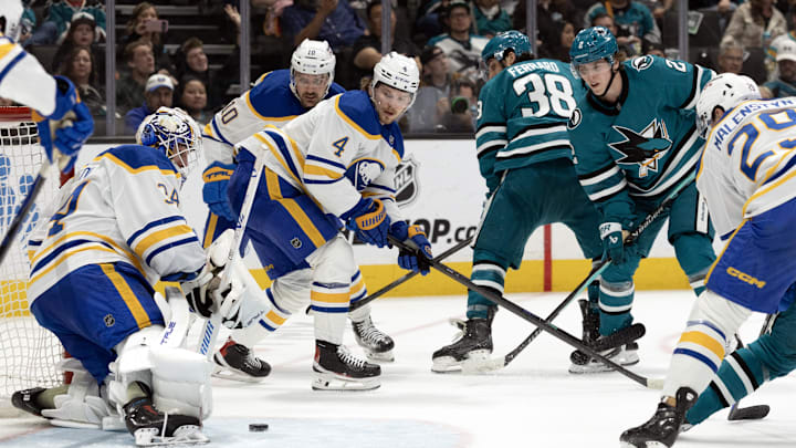 Mar 19, 2026; San Jose, California, USA; Buffalo Sabres goaltender Alex Lyon (34) blocks a shot on goal by San Jose Sharks center Will Smith (2) during the second period at SAP Center at San Jose. Mandatory Credit: D. Ross Cameron-Imagn Images