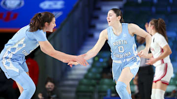 Nov 25, 2024; Paradise Island, Bahamas, BHS; North Carolina Tar Heels guard Lanie Grant (0) celebrates with North Carolina Tar Heels forward Ciera Toomey (21) after scoring during the first half against the Indiana Hoosiers at the Atlantis Resort. Mandatory Credit: Kevin Jairaj-Imagn Images