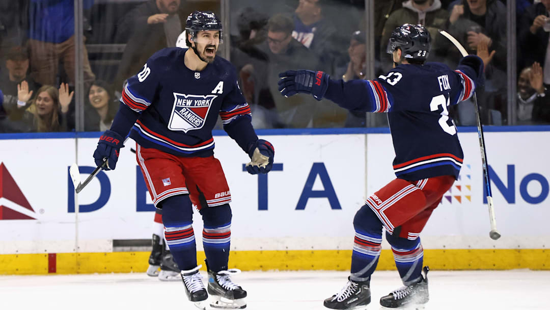 Kreider and Adam Fox celebrate a goal