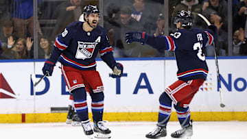 Kreider and Adam Fox celebrate a goal