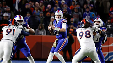 Buffalo Bills quarterback Josh Allen (17) looks downfield from the pocket against the Broncos.