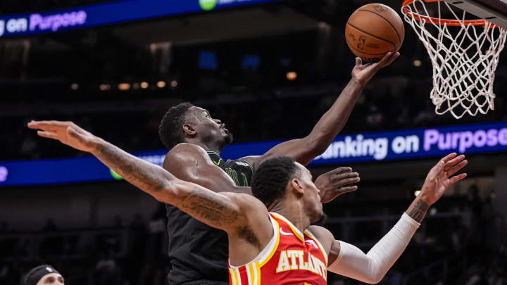 Mar 10, 2024; Atlanta, Georgia, USA; New Orleans Pelicans forward Zion Williamson (1) drives to the basket behind Atlanta Hawks guard Dejounte Murray (5) during the second half at State Farm Arena. Mandatory Credit: Dale Zanine-USA TODAY Sports