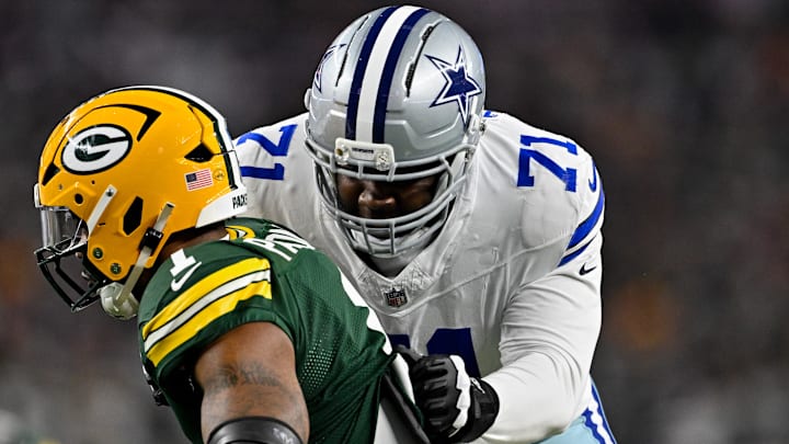 Sep 28, 2025; Arlington, Texas, USA; Dallas Cowboys offensive tackle Nate Thomas (71) blocks Green Bay Packers defensive end Micah Parsons (1) during the game between the Dallas Cowboys and the Green Bay Packers at AT&T Stadium. Mandatory Credit: Jerome Miron-Imagn Images