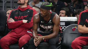 Jan 2, 2025; Miami, Florida, USA;  Miami Heat forward Jimmy Butler (22) looks on from the bench during the second half at Kaseya Center. Mandatory Credit: Jim Rassol-Imagn Images