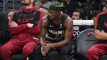 Jan 2, 2025; Miami, Florida, USA;  Miami Heat forward Jimmy Butler (22) looks on from the bench during the second half at Kaseya Center. Mandatory Credit: Jim Rassol-Imagn Images