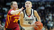 Dec 17, 2024; Uncasville, Connecticut, USA; UConn Huskies guard Paige Bueckers (5) drives the ball to the basket against Iowa State Cyclones forward Addy Brown (24) in the second half at Mohegan Sun Arena. Mandatory Credit: David Butler II-Imagn Images