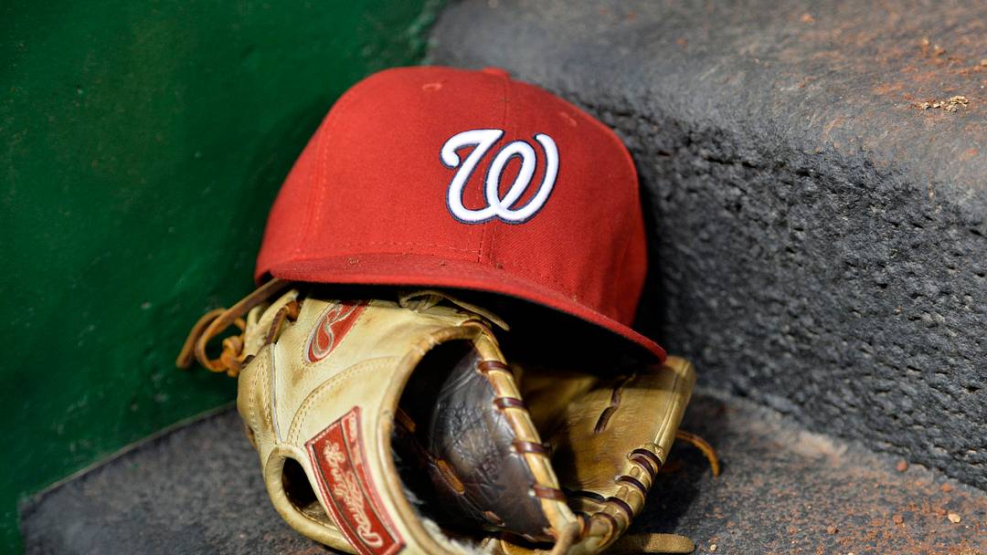 Apr 26, 2016; Washington, DC, USA; A general view of a Washington Nationals hat and glove in the dugout during the third inning against the Philadelphia Phillies at Nationals Park. Mandatory Credit: Tommy Gilligan-USA TODAY Sports