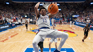 Feb 3, 2024; Lawrence, Kansas, USA; Kansas Jayhawks guard Kevin McCullar Jr. (15) dunks the ball during the first half against the Houston Cougars at Allen Fieldhouse.