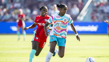 Oct 19, 2024; Kansas City, Missouri, USA; Kansas City Current forward Nichelle Prince (8) and San Diego Wave FC defender Naomi Girma (4) go after the ball during the first half at CPKC Stadium. Mandatory Credit: Nick Tre. Smith-Imagn Images