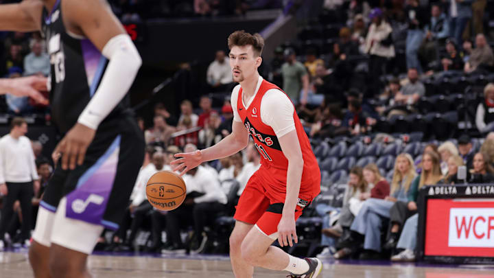 Mar 14, 2025; Salt Lake City, Utah, USA; Toronto Raptors center Colin Castleton (11) looks to pass the ball during the second half against the Utah Jazz at Delta Center. Mandatory Credit: Chris Nicoll-Imagn Images Mar 14, 2025; Salt Lake City, Utah, USA; Toronto Raptors center Colin Castleton (11) looks to pass the ball during the second half against the Utah Jazz at Delta Center. Mandatory Credit: Chris Nicoll-Imagn Images