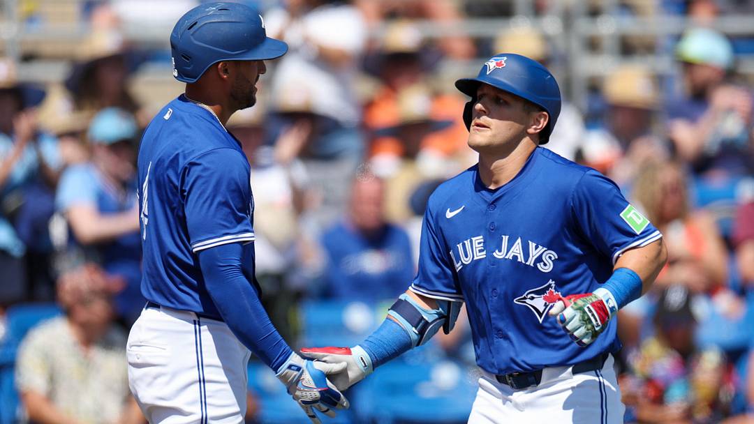 Mar 13, 2025; Dunedin, Florida, USA; Toronto Blue Jays outfielder Daulton Varsho (5) celebrates with outfielder George Springer (4) after hitting a two run home run against the Baltimore Orioles in the fifth inning during spring training at TD Ballpark. Mandatory Credit: Nathan Ray Seebeck-Imagn Images