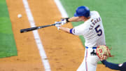 May 14, 2024; Arlington, Texas, USA;  Texas Rangers shortstop Corey Seager (5) hits a home run