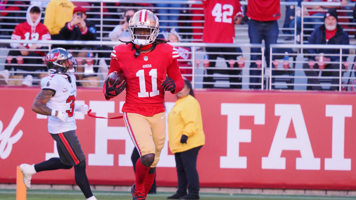 Nov 19, 2023; Santa Clara, California, USA; San Francisco 49ers wide receiver Brandon Aiyuk (11) runs after a catch for a 76-yard touchdown against the Tampa Bay Buccaneers during the third quarter at Levi's Stadium. Mandatory Credit: Kelley L Cox-USA TODAY Sports