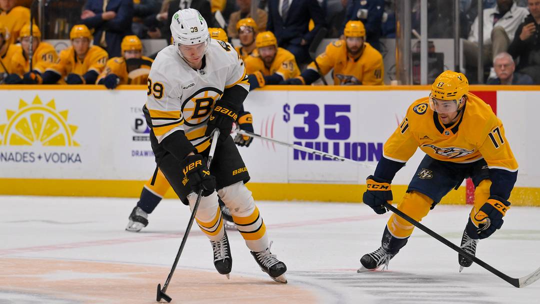 Mar 5, 2026; Nashville, Tennessee, USA;   Boston Bruins center Morgan Geekie (39) skates with the puck against the Nashville Predators during the second period at Bridgestone Arena. Mandatory Credit: Steve Roberts-Imagn Images