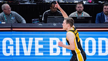 Mar 13, 2025; Indianapolis, IN, USA; Iowa Hawkeyes forward Payton Sandfort (20) celebrates a made basket in the first half Illinois Fighting Illini at Gainbridge Fieldhouse. Mandatory Credit: Trevor Ruszkowski-Imagn Images