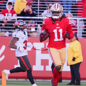 Nov 19, 2023; Santa Clara, California, USA; San Francisco 49ers wide receiver Brandon Aiyuk (11) runs after a catch for a 76-yard touchdown against the Tampa Bay Buccaneers during the third quarter at Levi's Stadium. Mandatory Credit: Kelley L Cox-USA TODAY Sports